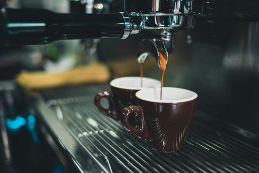 A professional espresso machine brewing coffee