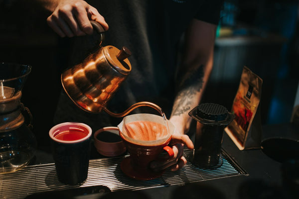 Hot water being poured over a V60 coffee dripper